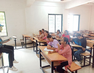 Students Learning the Guitar